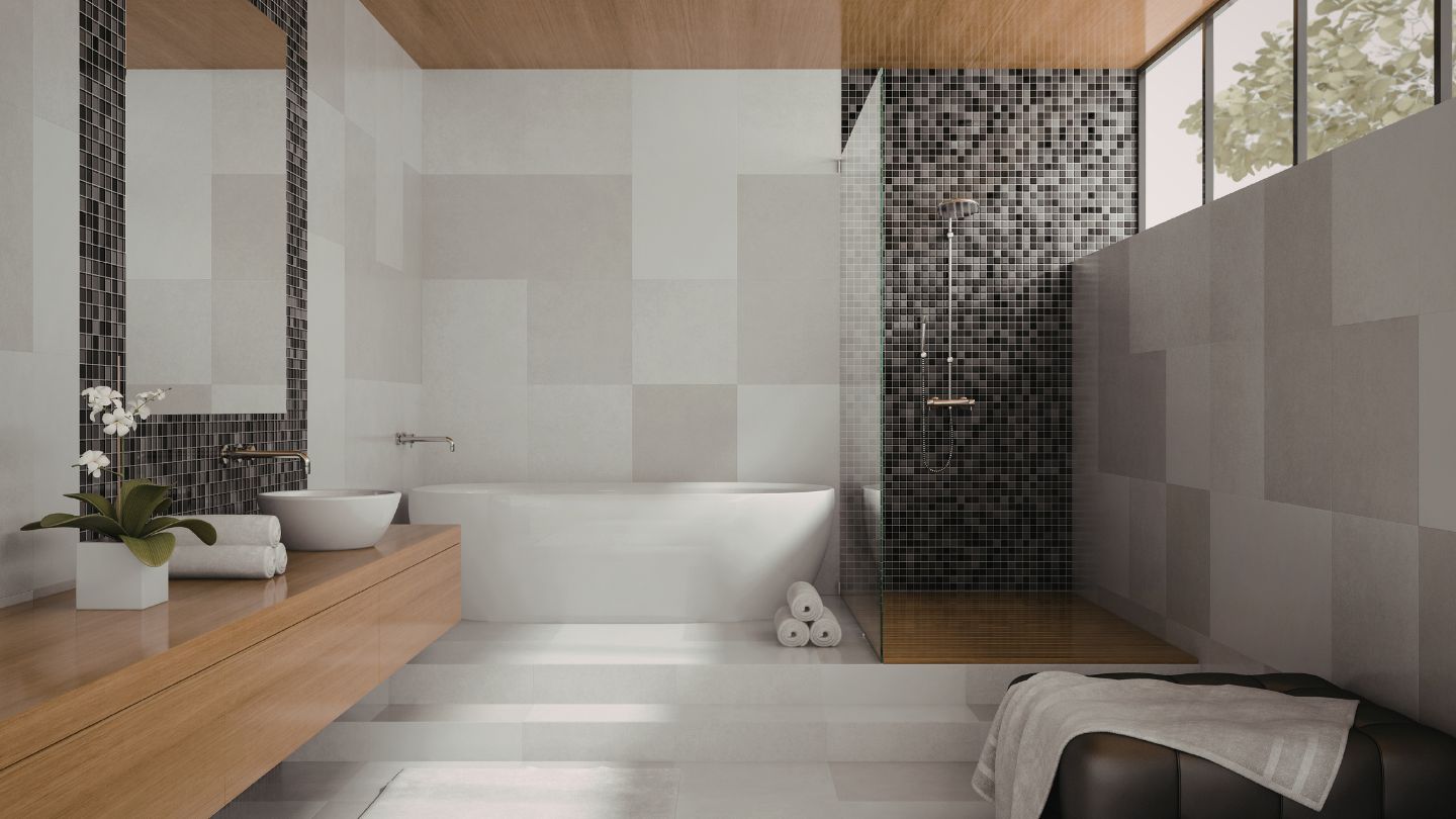 Modern bathroom tile installation with freestanding tub and mosaic shower