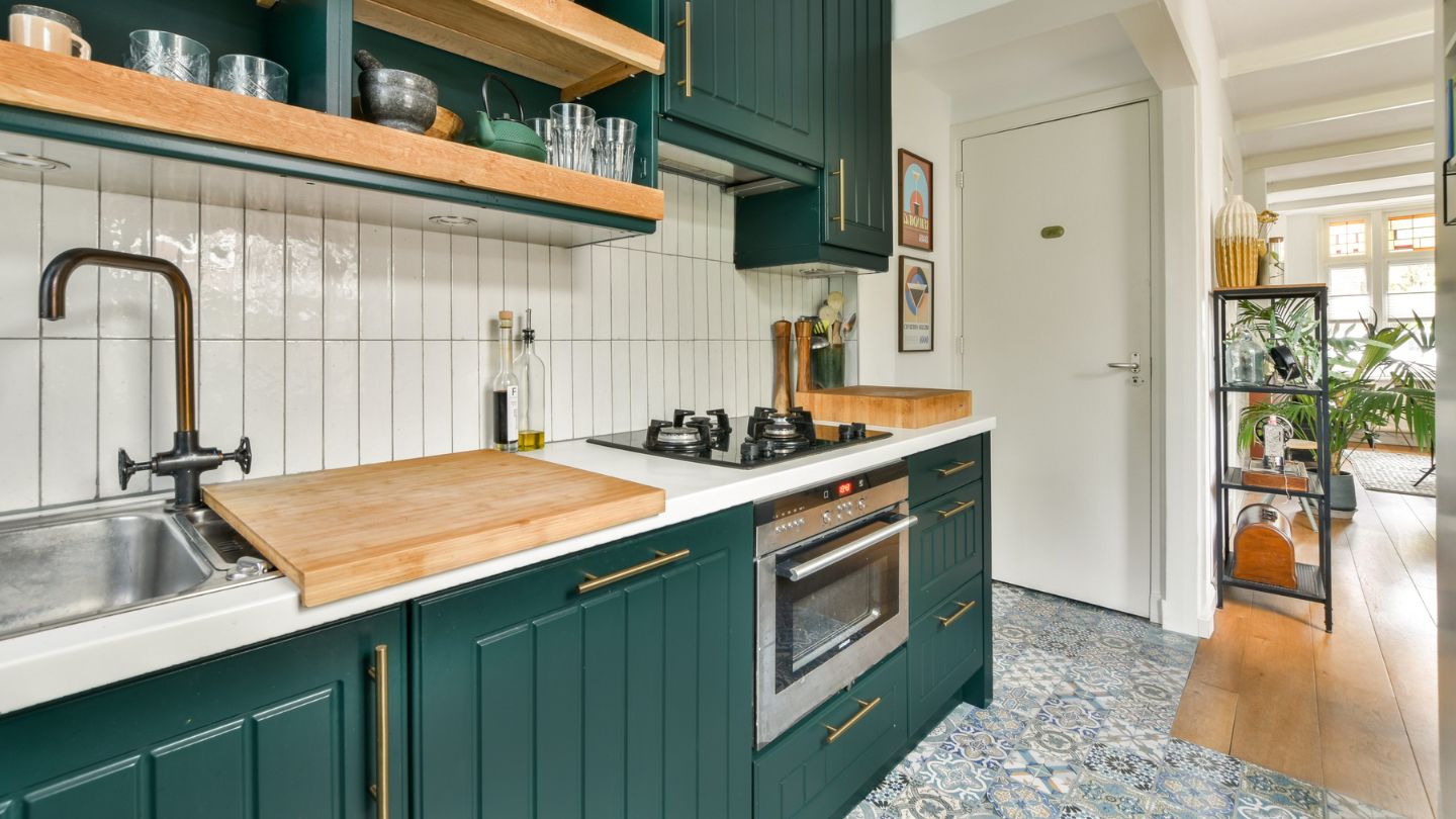 Cabinet painting in kitchen in Florida with green shaker cabinets
